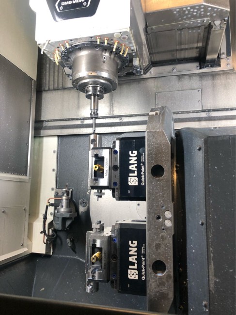 Cnc vise positioned accurately in a zero point clamping system from LANG Technik